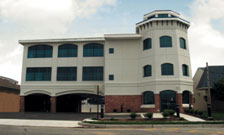 Bank building, white and brick with lighthouse shaped tower