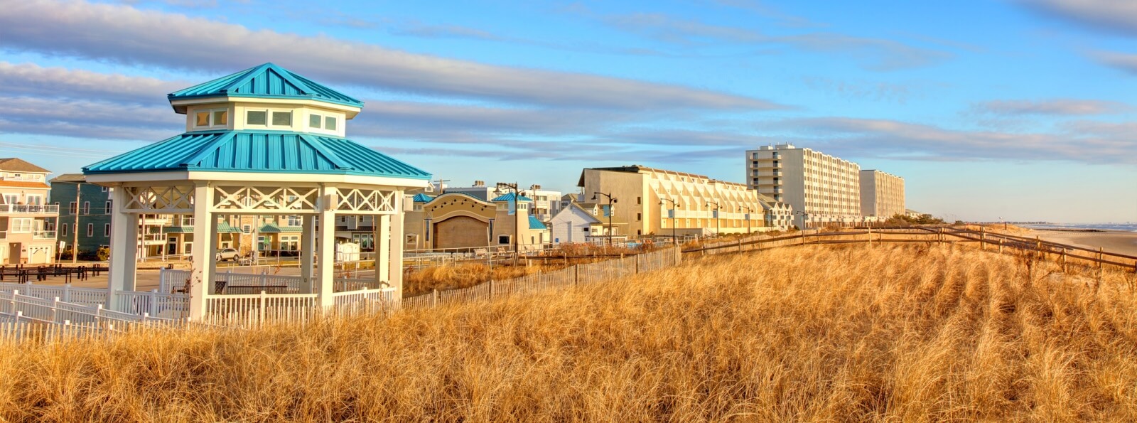 landscape of a grassy beach and gazebo